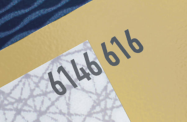 Cold-indent decoration for card verification number on gold debit card
