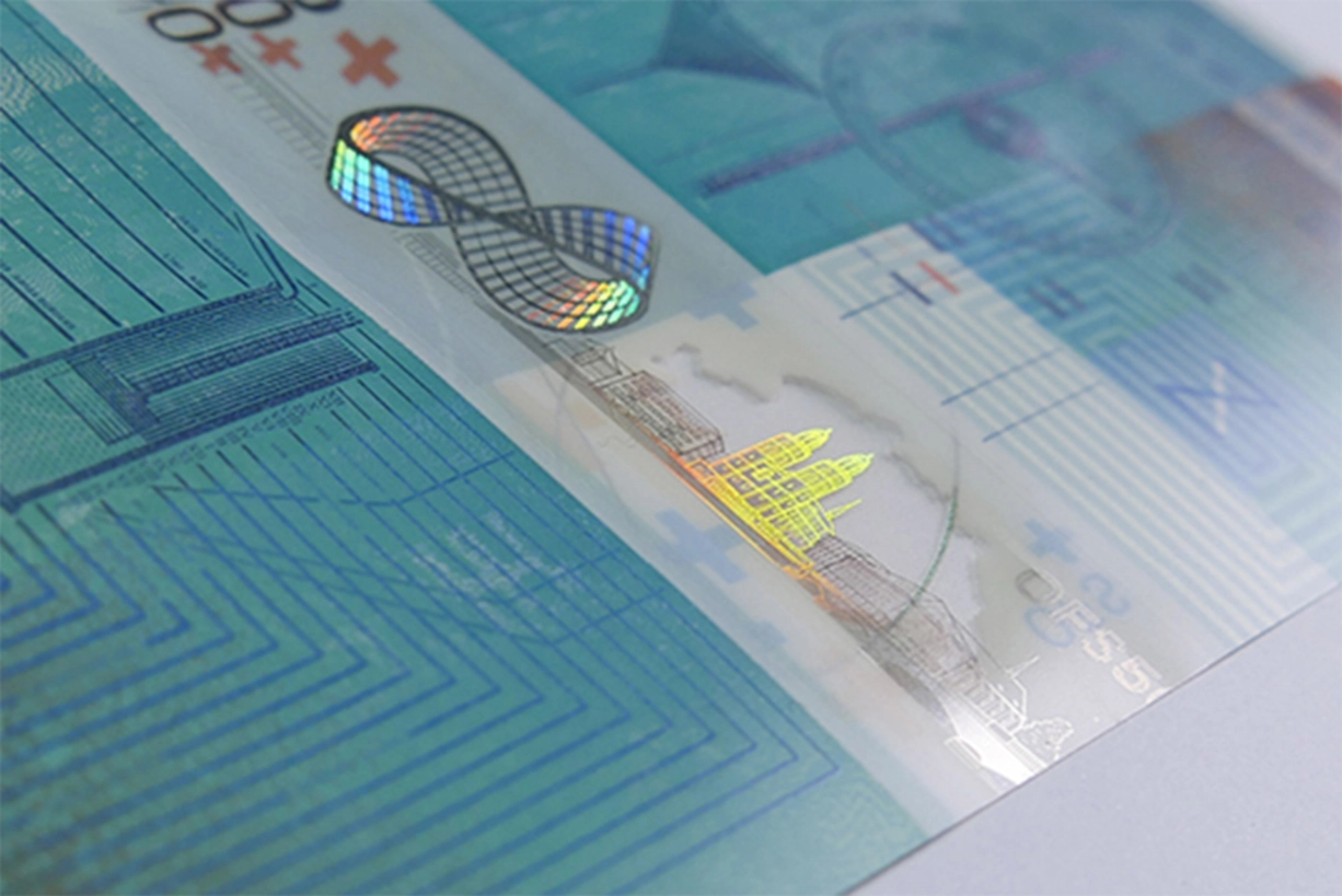 Polymer Banknotes or Paper Bills: KURZ Metallizations Offer Sustainable Protection Partially metallized banknote with security thread by LEONHARD KURZ