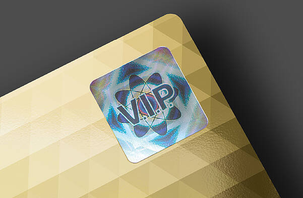 Security hologram on gold plastic card by KURZ