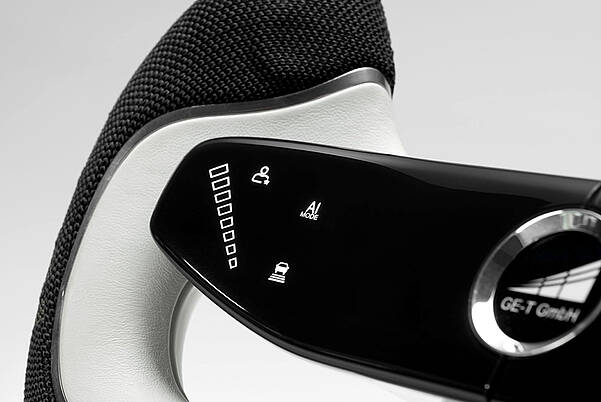 Steering wheel for GE-T with futuristic controls by LEONHARD KURZ
