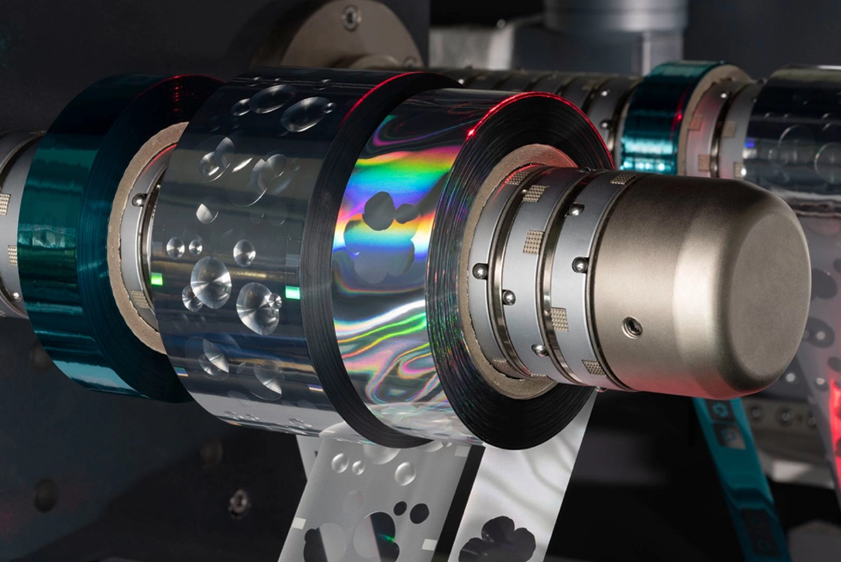 Hologram cold foils for premium label embellishment Detail view: Cold transfer machine with holographic foils